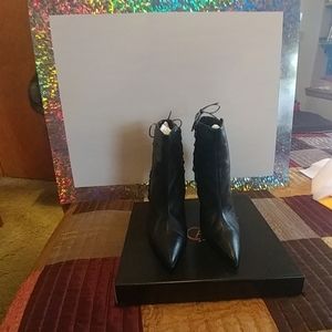 Black leather and patent leather 5 inch Boots.